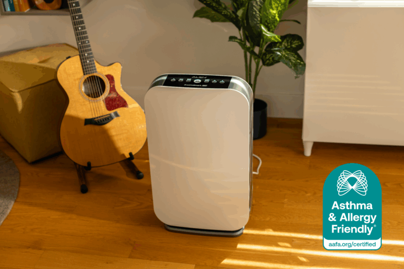 Alen BreatheSmart air purifier in a sunlit room with Asthma & Allergy Friendly® Certification mark in the foreground