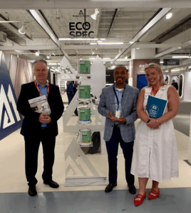 Benjamin Moore representatives with Allergy Standards Ltd at Eco Spec® paint display, receiving Asthma & Allergy Friendly® Certification award.