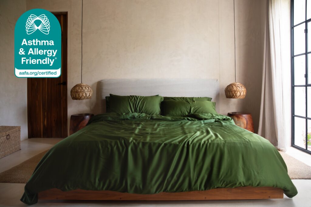 Asthma & Allergy Friendly® Certified SIJO bedding in a modern bedroom with green sheets, promoting healthier indoor air quality.