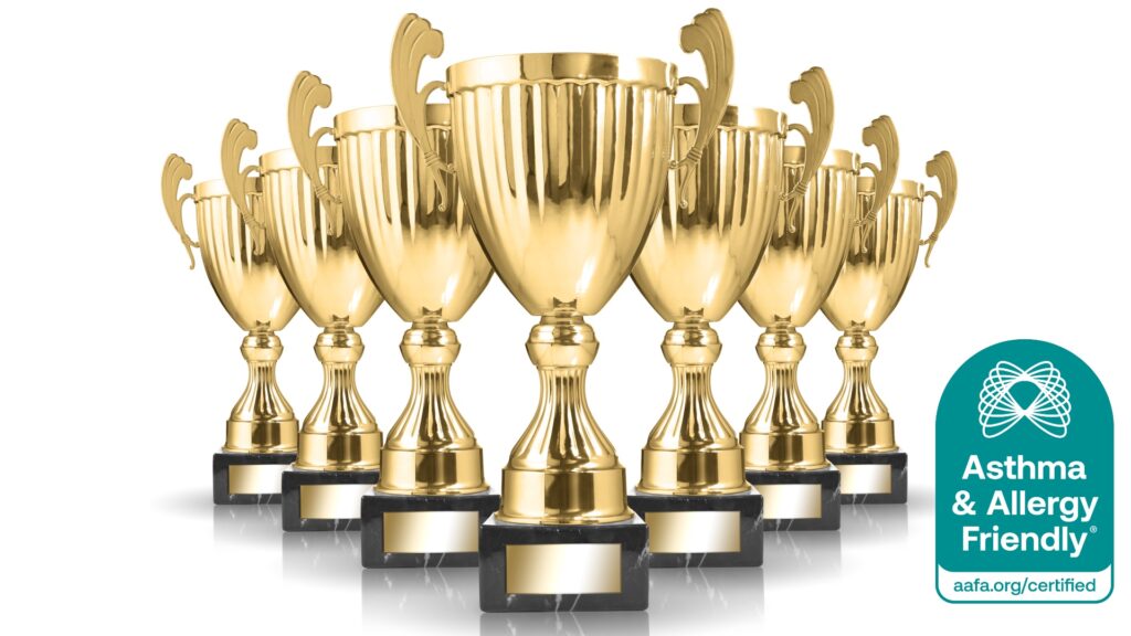Gold trophies representing industry and media awards earned by Certified Asthma & Allergy Friendly® products