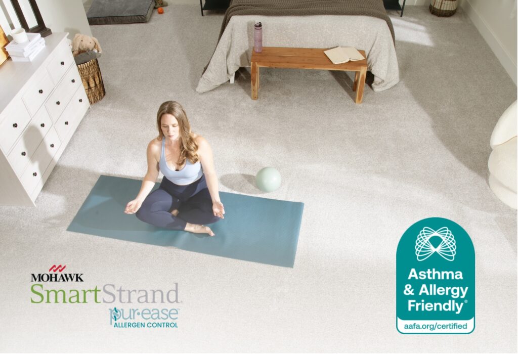 Woman practicing yoga on Mohawk SmartStrand carpet with Pur-Ease technology certified Asthma & Allergy Friendly